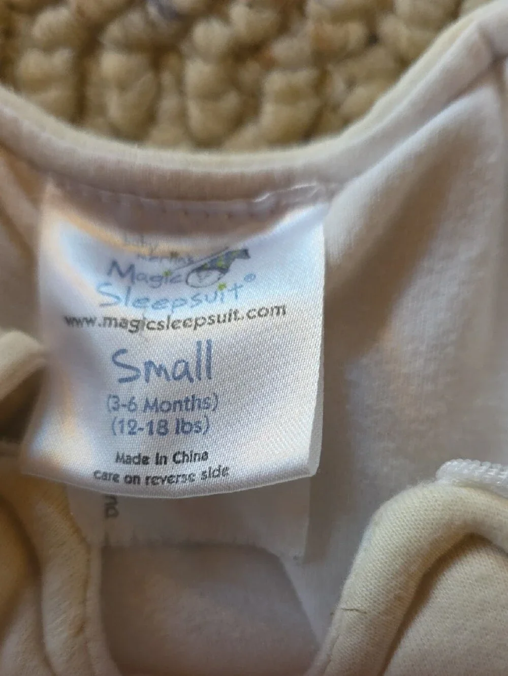 Cream Baby Sleepsuit with Blue Embroidered Logo